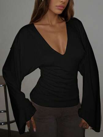 Elegant Women's Black Knitted Top Featuring A Deep V Neck And Flowy Flare Long Sleeves Comfortable High Stretch Design