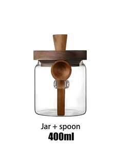 1个带勺子的玻璃咖啡罐，带盖密封食品储存容器，适合存放咖啡豆、干果、餐食准备、酸奶、奇亚籽、谷物、糖、布丁、牛奶、早餐、外卖餐食和零食，配有木勺和盖子。