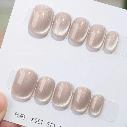 10片手工制作的按压式美甲贴片，短椭圆形，杏色，Y2K极简柔和风格，纯色猫眼图案，带细闪，适合女性和女孩，秋冬季节、节日、圣诞派对、日常美甲用品。