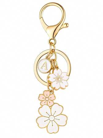 1 st nyckelring med Sakura-blommor i initialform, perfekt present till vänner