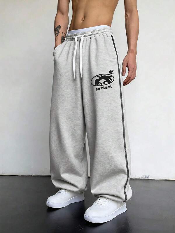 Pantalones de chándal casuales de estilo americano para hombres, con estampado, de moda, versátiles, de corte holgado, bajo ajustable, con cordón y pierna recta