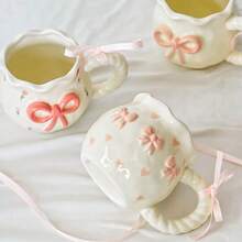 1pc Creative 3D Embossed Hand-Painted Bow Design Ceramic Coffee Mug With Ribbon, Delicate Packaging, Ideal For Gifts