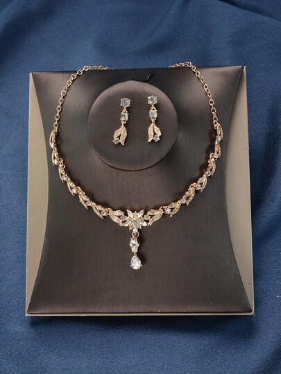 طقم قلادة وأقراط من سبيكة الزنك بطراز ملكي ذهبي مرصع بالراين ستون، مزين بتصميم الراين ستون والأوراق، مجوهرات للعرائس وحفلات الزفاف، مناسب للاستخدام طوال العام