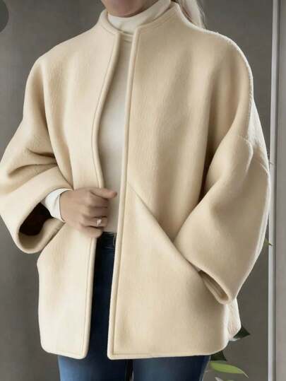 معطف نسائي أنيق طويل من القماش المنسوج باللون البنفسجي مع طوق عمودي وأكمام ضيقة عند الرسغ