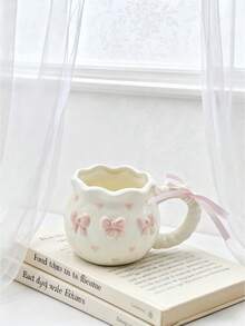 1pc Creative 3D Embossed Hand-Painted Bow Design Ceramic Coffee Mug With Ribbon, Delicate Packaging, Ideal For Gifts