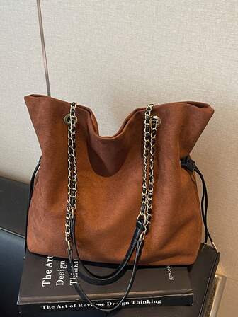 Dual Twin Declaration | Genuine Bucket Tote Bag ​​Two-Tone Brown * Gold Chain Patchwork | Unlock The Urban Commuting Aesthetics​​ The Deep Brown Body Flows With Delicate Matte Luster, And The Drawstring Bucket Silhouette Reproduces The Slouchy Elegance.​​ The Golden Chain And The Black Leather Shoulder Strap Are Patchworked, And The Length Can Be Freely Adjusted Through The Metal Ring.