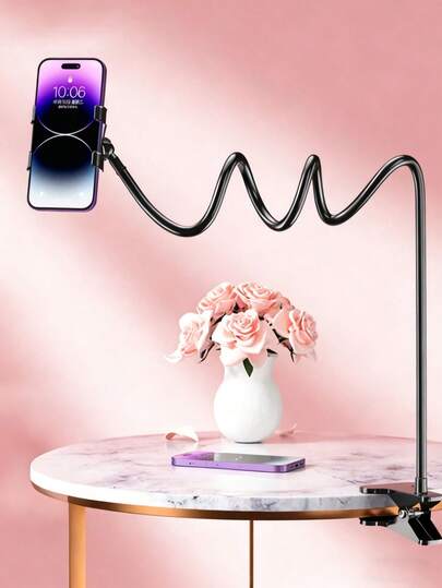 这款手机支架可360°旋转，解放双手。这款懒人支架可以调节到所需的弧度来支撑您的手机，适合床头和桌面使用。适用于重量不超过200克的手机。