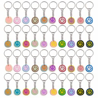 14/18/21/24/27/30/40 stuks schattige sleutelhangers met een lachend gezichtje, geschikt als bedankje voor een feestje, als feestartikelen en als cadeau voor de start van het schooljaar.