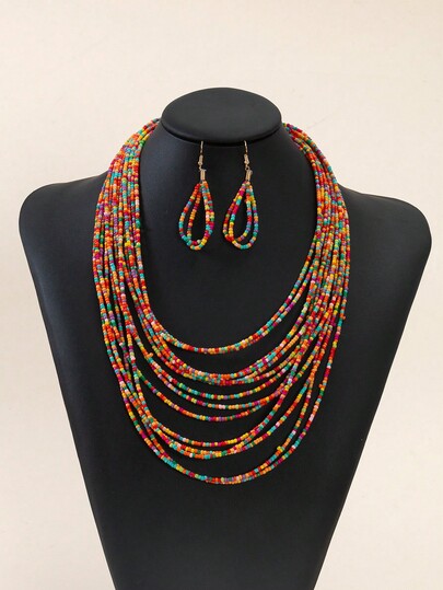 Ensemble de collier et boucles d'oreilles multicouches colorés en perles de rocaille bohème pour femmes, bijoux multicolores faits main, ensemble de bijoux à plusieurs rangs de style boho chic, idéal pour les festivals, les fêtes et les tenues quotidiennes, cadeau de bijoux unique pour les femmes et les filles