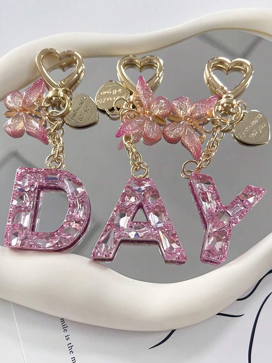 1pc Shiny Pink Rhinestone 26 Alphabet Letter Keychain, With Heart Tag Butterfly Metal Heart Charm Pendant, Creative Fashion Women Backpack Decor, Party Gathering Stylish Gift, Anniversary, Valentine's Day, Christmas Gift For Friends, Family, Teachers Bag Charms Car Accessories Sister Gift Ideas