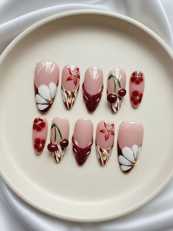 Ilumina tus uñas - Juego de 10 uñas postizas de almendra de longitud media hechas a mano para el otoño/invierno, con degradado nude-rojo, puntas francesas de cebra, decoración floral y de cereza pintada a mano, relieve 3D de gota y acentos 3D de perlas doradas, juego de uñas removibles y reutilizables (incluye pegamento y lima de uñas) - y uñas navideñas lindas