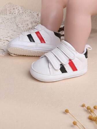 1双男女通用撞色PU魔术贴休闲运动鞋，适合春秋季穿着