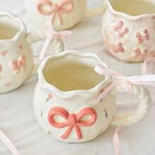 1pc Creative 3D Embossed Hand-Painted Bow Design Ceramic Coffee Mug With Ribbon, Delicate Packaging, Ideal For Gifts