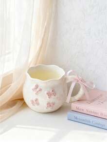 1pc Creative 3D Embossed Hand-Painted Bow Design Ceramic Coffee Mug With Ribbon, Delicate Packaging, Ideal For Gifts