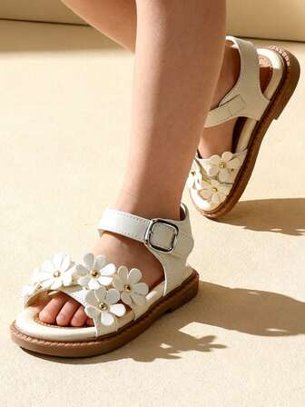 1 par de sandalias para niñas pequeñas, con decoraciones de lazo y hebilla de metal, hechas de piel sintética, antideslizantes y resistentes al desgaste, de punta abierta y de caña baja, de tacón plano, en un estilo casual y dulce, adecuadas para viajes a la playa en verano / vacaciones al aire libre.