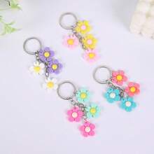 16个向日葵/雏菊造型钥匙扣PVC材质，可作包包挂件，适合节日派对、汽车装饰、包包挂饰、学校万圣节饰品、教师节礼物、送给朋友或姐妹的礼物创意