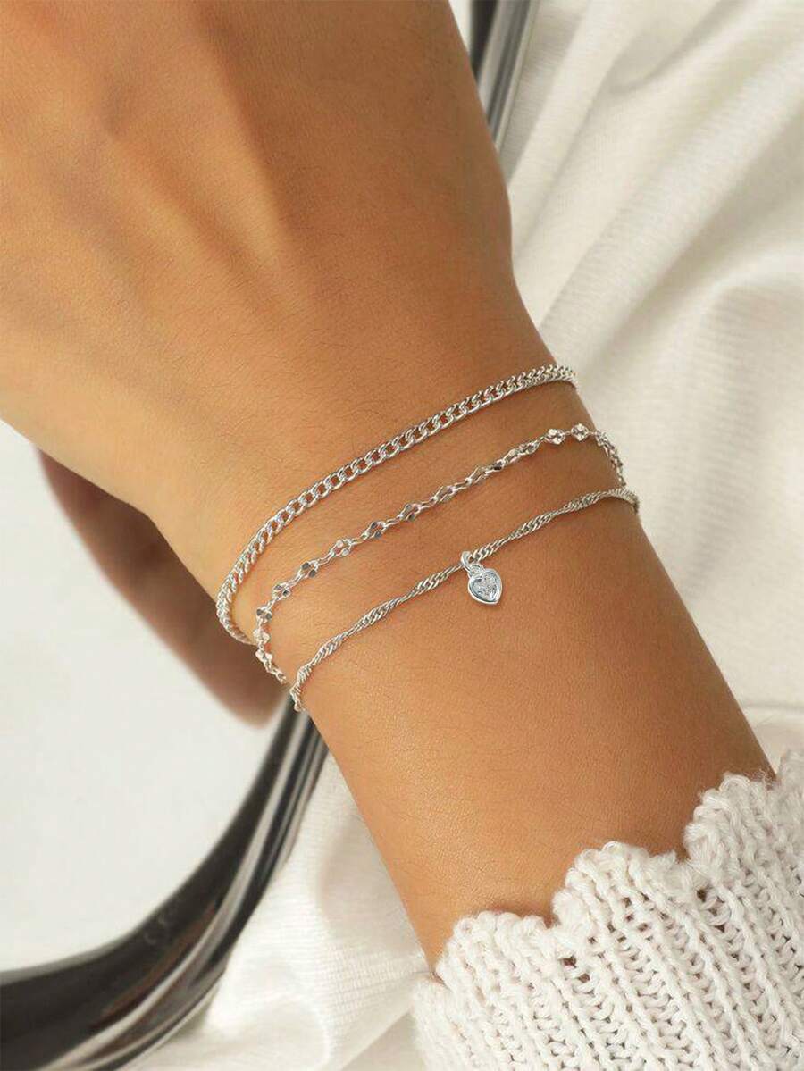 Nooxian 3件套银饰时尚休闲银色铜锆石心形吊坠，配波浪链、唇形链和普通链，三层手链套装，适合女性日常佩戴 - 銀色 - 查看 1