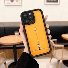 Cubierta de telefono con borde negro y parte trasera naranja con diseño de figura humana sosteniendo globo amarillo ideal para uso diario en cafeterias y espacios urbanos Aplicable a los teléfonos de la serie Apple y Galaxy - Café integral - Ver 1