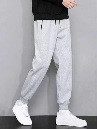 Pantalones de chándal casuales para hombres con bolsillos y dobladillo con cremallera, pantalones largos de ajuste holgado y versátiles para primavera y otoño