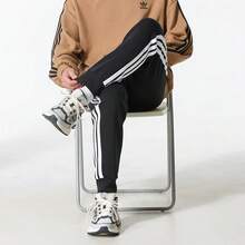 Quần thể thao nam Adidas 2026 mùa xuân mới, kiểu dáng thường ngày, lót giữ nhiệt, 3 sọc, ống côn, chất liệu bền chắc, mã JD1861. - màu đen - Xem 7
