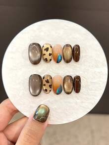 10PCS High-Quality Handmade Leopard Print Blurred Huge Starry Sky Cat Eye Short Pressed Nails Suitable For Women's Daily Wear, Parties, And Gatherings. The Pressed Nails Come With Jelly Glue And Rubbing Strips As A Gift. [ Essential Nails For Autumn And Winter ]