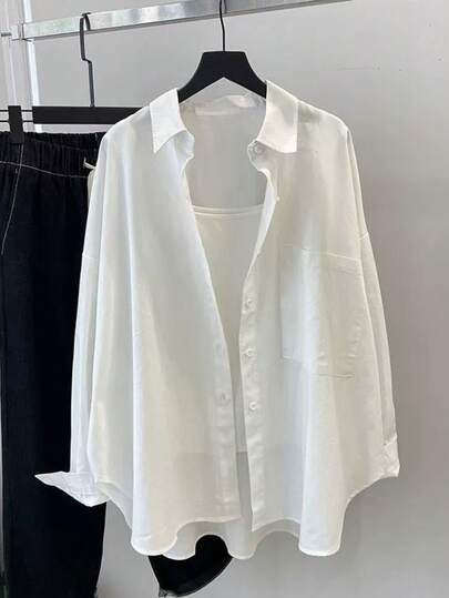 Áo kiểu nữ màu trơn, cài cúc phía trước, dáng rộng, có túi, tay dài, vai rớt, màu trắng, thích hợp cho mùa xuân.