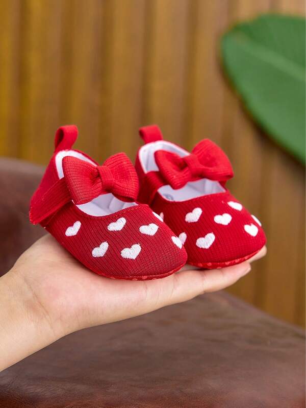Zapatos de princesa para bebé niña de primavera/otoño, zapatos planos suaves y lindos con lazo y corazón para bebés de 0 a 1 año, ajustables y ligeros, adecuados para uso diario, fiestas, interior y exterior