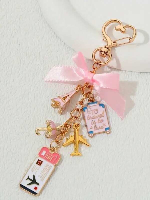 1个旅行主题钥匙扣，带有埃菲尔铁塔、飞机和行李箱吊坠 - 粉色蝴蝶结和金色点缀，刻有“我的爱”字样的标签 - 耐用的金属材质，适合送给女性、旅行者、生日、周年纪念日、生日礼物、趣味吊坠，也是送给家人、朋友和爱人的绝佳礼物，非常适合斋月、开斋节、情人节、圣诞节或感恩节。