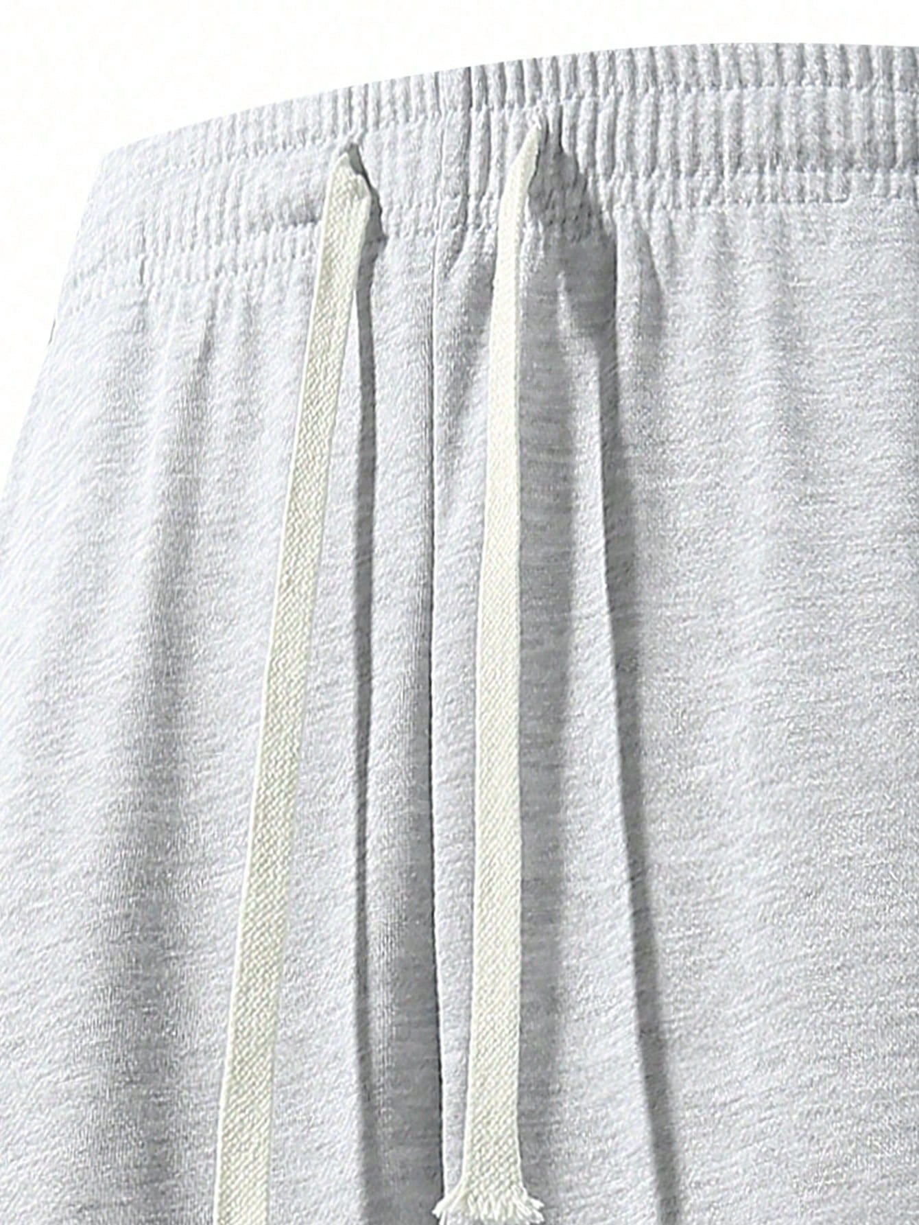 بنطلون رياضي رجالي فضفاض ذو ساق مستقيمة، باللون ال...