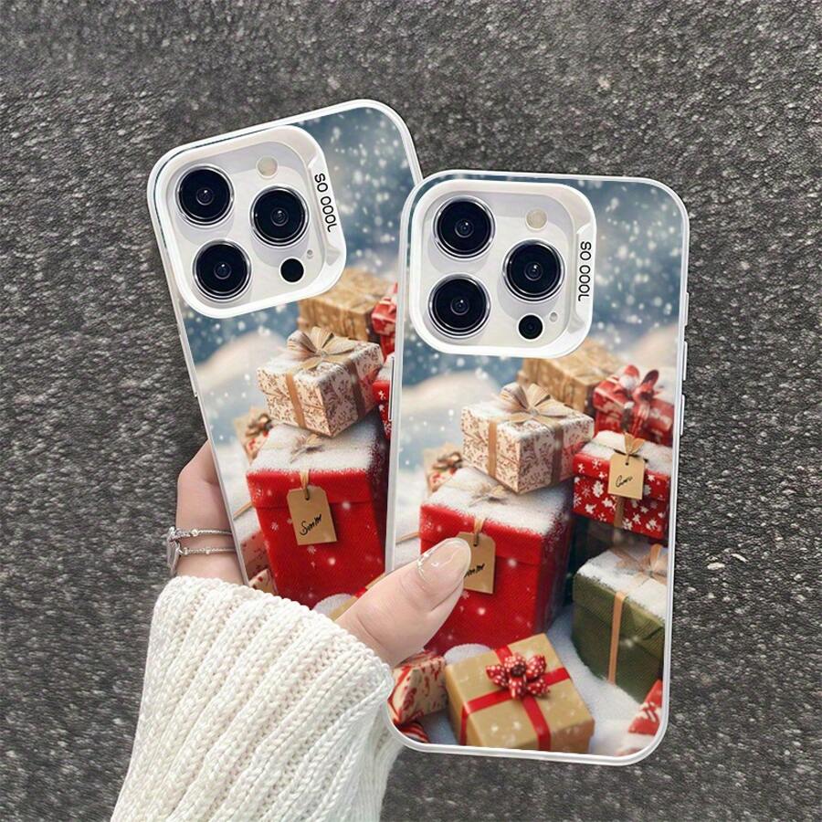 Una caja de regalo con temática navideña que presenta copos de nieve y diseños invernales, también disponible en versiones con temática de Halloween.Esta funda de teléfono moderna y linda es compatible con Apple 16, 15, 14, 13, 12, 11 Pro Max, Pro Plus y 16E. - Colores mixtos - Ver 1