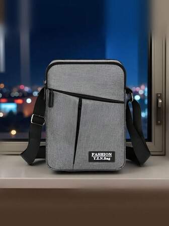 大容量时尚男士单肩斜跨邮差包，多功能可调节肩带拉链开合，多隔层实用收纳男包
