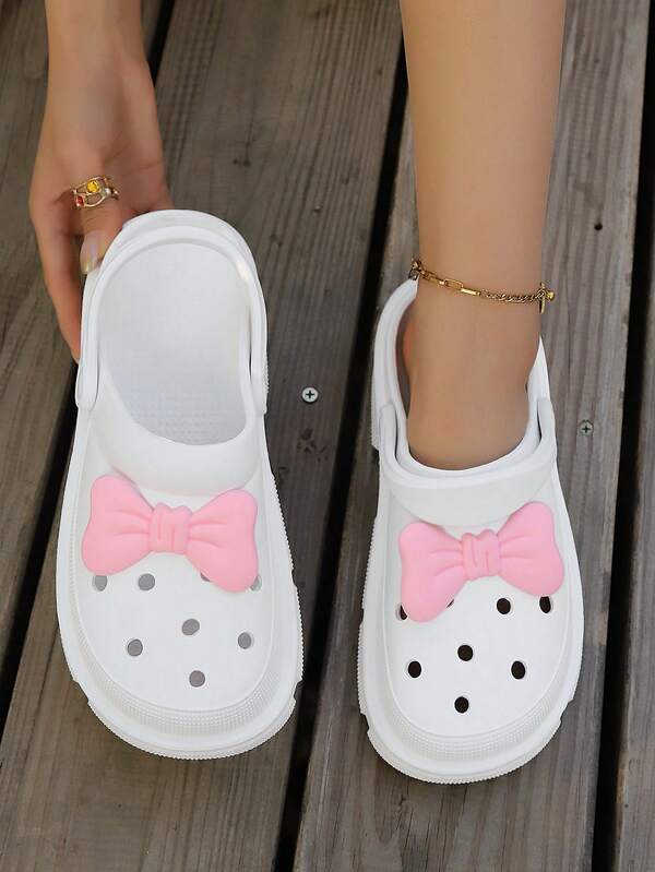 أحذية كلوج نسائية بنعل سميك من EVA مقاوم للماء وخفيف الوزن مزينة بفيونكة وردية