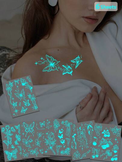 مجموعة مؤقتة من الوشم المضيء في الظلام من روكوارت - 6 قطع - أزرق داكن، فراشات بيضاء، قلب، زهور، نجوم - سهل التطبيق والإزالة