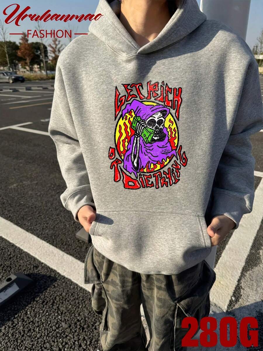 Unisex Gray Hoodie with Bold Print - Skeleton in Purple Hoodie Holding Green Book, Surrounded by Flame Motif. "GET RICH OR TRYING" in Red Letters. Perfect for Street Style, Gym, Casual Outings. Trending: Streetwear, Graphic Tees, Comfort Fashion. - Gris - Ver 1