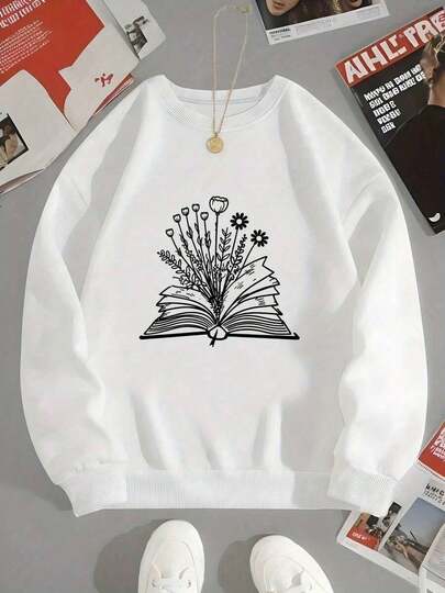 Black Crewneck Sweatshirt With White Graphic Design - Open Book With Fanned Pages & White Line-Drawn Flowers/Leaves/Stems, Whimsical Nature-Inspired Illustration |     Light Gray/White Textured Background - Unisex Casual Pullover For Daily Wear, Outdoor Activities, & Relaxed Style