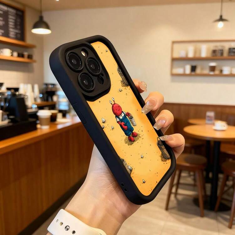 Cubierta de teléfono con borde negro y diseño amarillo con personaje de cangrejo rojo en overol azul sosteniendo cubo y piedras en escena de playa para uso diario en cafeterías Aplicable a los teléfonos de la serie Apple y Galaxy - Café integral - Añade 6
