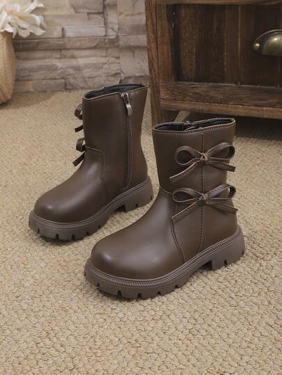 1双棕色女童柔软舒适PU皮靴，带蝴蝶结、侧拉链、圆头、保暖内衬，时尚经典中筒靴，适合3-15岁女孩，日常、度假、上学、秋冬季穿着。