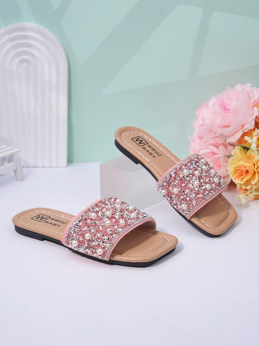 A Pair Of Fashionable Girls' Flip-Flops - A New Summer Style In Pink With Pearl And Rhinestone Studded Slip-On Sandals