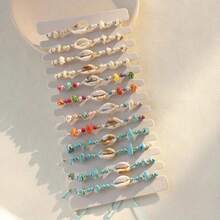 12 piezas Pulseras tejidas con elementos de playa oceánica, estrellas de mar, cuentas de turquesa y conchas (color y estilo aleatorios), tarjeta aleatoria incluida - Multicolor - Ver 9