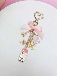 1个旅行主题钥匙扣，带有埃菲尔铁塔、飞机和行李箱吊坠 - 粉色蝴蝶结和金色点缀，刻有“我的爱”字样的标签 - 耐用的金属材质，适合送给女性、旅行者、生日、周年纪念日、生日礼物、趣味吊坠，也是送给家人、朋友和爱人的绝佳礼物，非常适合斋月、开斋节、情人节、圣诞节或感恩节。 - 彩色 - 查看 7