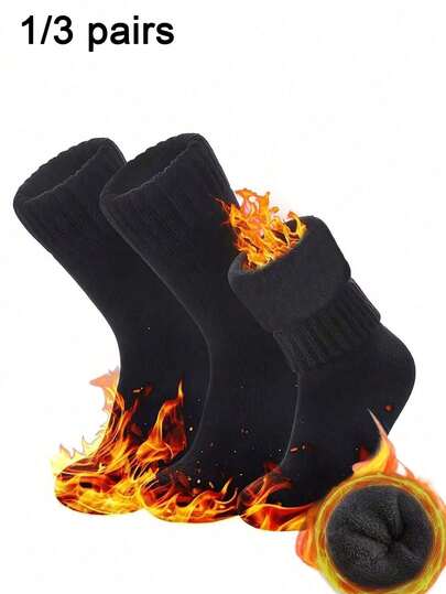 1/3双装男女通用加厚保暖黑色中筒袜，柔软舒适，适合日常穿着或户外运动，秋冬季节适用。