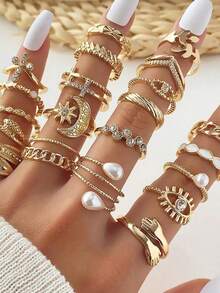 Bộ 23 chiếc nhẫn sang trọng hình mắt, đính ngọc trai giả, nhiều kiểu dáng, trang trí bằng đá quý, thích hợp cho phụ nữ đeo hàng ngày. - Nhiều màu - Xem 1