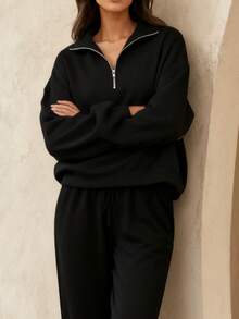 A Loose-Fitting Women's Sweatshirt With A Half-Zip Stand-Up Collar And Drawstring Casual Pants Creates A Relaxed And Sporty Women's Set. This Outfit Features A Loose And Casual Fit, Perfect For Comfortable Everyday Wear. - màu đen - Xem 6
