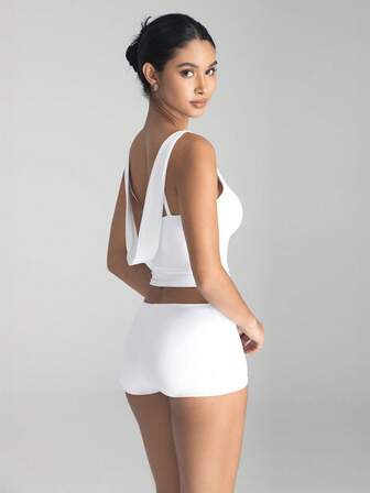 Top sin mangas de unicolor con cuello redondo y espalda sexy para mujer