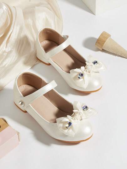 زوج من أحذية الفتيات الصغيرات/الأطفال الأنيقة ذات الكعب العالي من جلد البولي يوريثان بتصميم مزين بالراين ستون والخرز والفيونكة، مناسبة للفساتين والحفلات والعروض، مناسبة للربيع والصيف والخريف