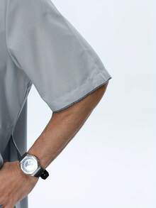 Al Haramain Men's Light Grey Short Sleeve Traditional Robe, Elegant Embroidery Accent Chest Pocket, Minimalist Sophisticated Style