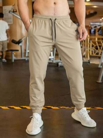 Pantalones deportivos para hombres con puños elásticos, tela ligera, transpirable y con caída con estiramiento, una silueta que adelgaza y alarga las piernas, adecuados para deportes, fitness, correr, jugar a la pelota y uso al aire libre