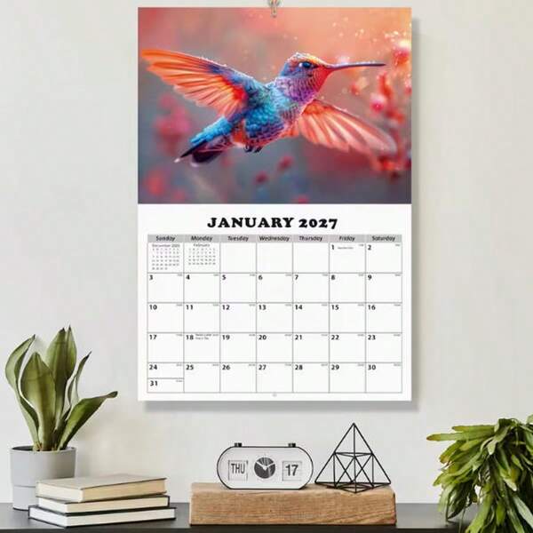 كتاب مقاس A3 [تقويم طائر الكولبري 2026] بأسلوب إنستغرام، تقويم طبيعي من يناير 2026 إلى يناير 2027. غلاف مصور بتصوير عالي الدقة لطائر الكولبري، صورة واحدة عالية الجودة لطائر الكولبري لكل شهر، ورق مطلي من الجانبين بطباعة عالية الدقة، تجليد بالخياطة المتقاطعة. مناسب للتخطيط الجدولي المنزلي أو المكتبي