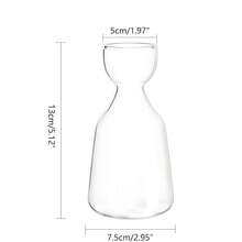 A Transparent Avocado Glass Hydroponic Vase - A Modern Cylindrical Home Decor Design That Requires No Batteries, Allowing Clear Observation Of Root Growth.