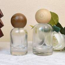 1个高档圆形木纹30毫升/50毫升可灌装防漏可重复使用便携旅行香水瓶